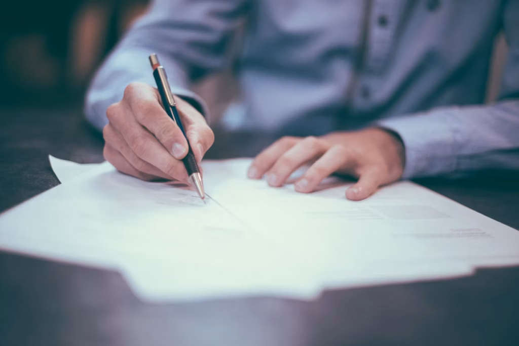 Business owner reviewing LLC insurance documents at a desk