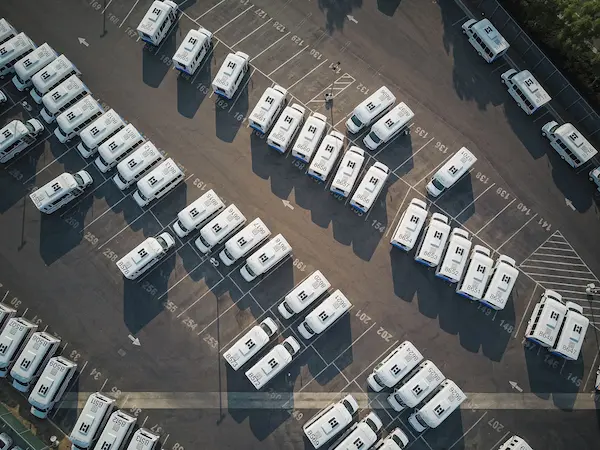 commercial fleet vehicles parked in a row representing commercial auto insurance coverage