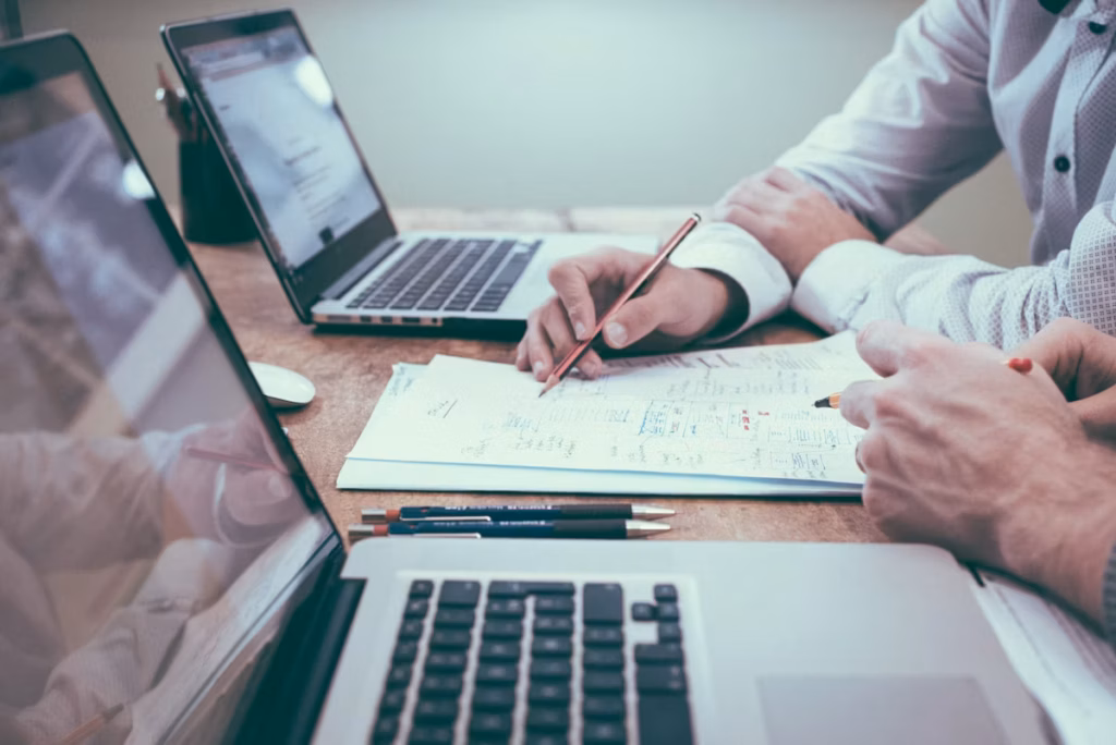 Professional reviewing errors and omissions insurance policy documents at a business desk