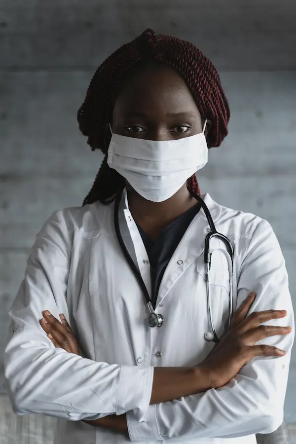 Doctor reviewing patient medical records in hospital setting, representing the standard of care in medical practice