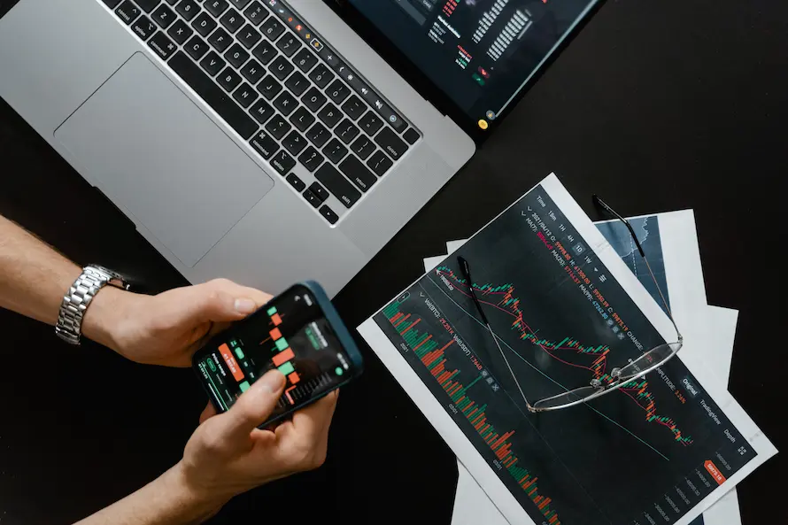 Investor reviewing financial portfolio documents showing diversified mutual fund holdings