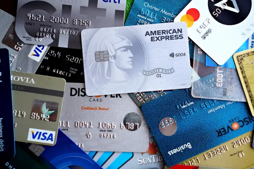 A collection of various credit cards, illustrating the best credit card rewards strategies 2026 for maximizing cash back and travel points.