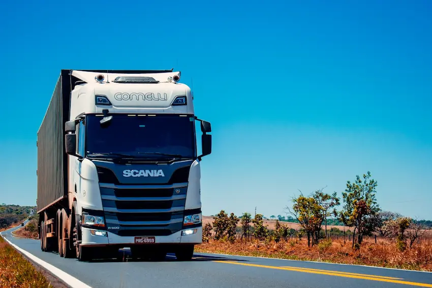 Large commercial semi-truck driving on a highway representing trucking accident risks