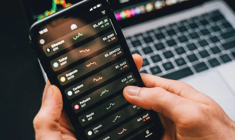 A person analyzing market trends on a mobile trading app, representing the best online stock brokers and investment platforms in 2026.