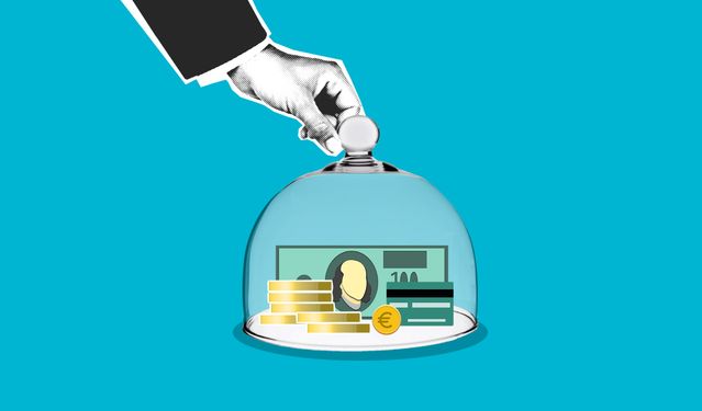 A conceptual illustration of a hand lifting a glass cloche dome over stacked gold coins, a 100-dollar bill, and a credit card against a solid blue background, symbolizing financial protection and banking insurance limits.