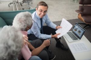 "A financial advisor explaining retirement planning documents to a senior couple."